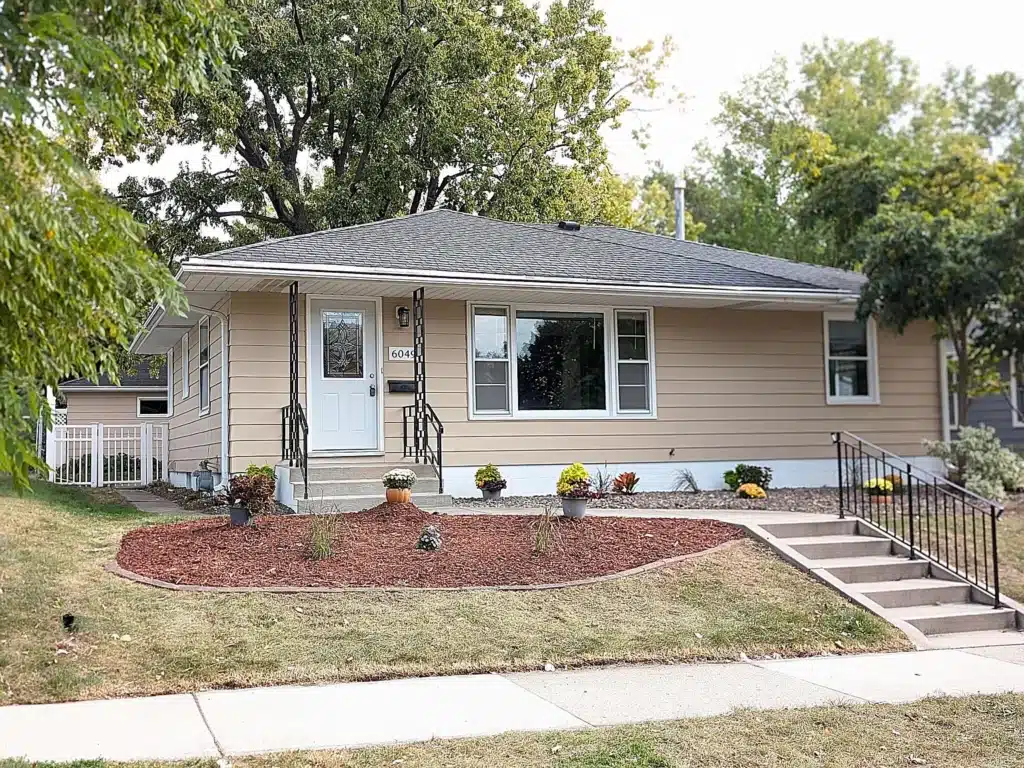 The front of a brown house that we listed in Minnesota